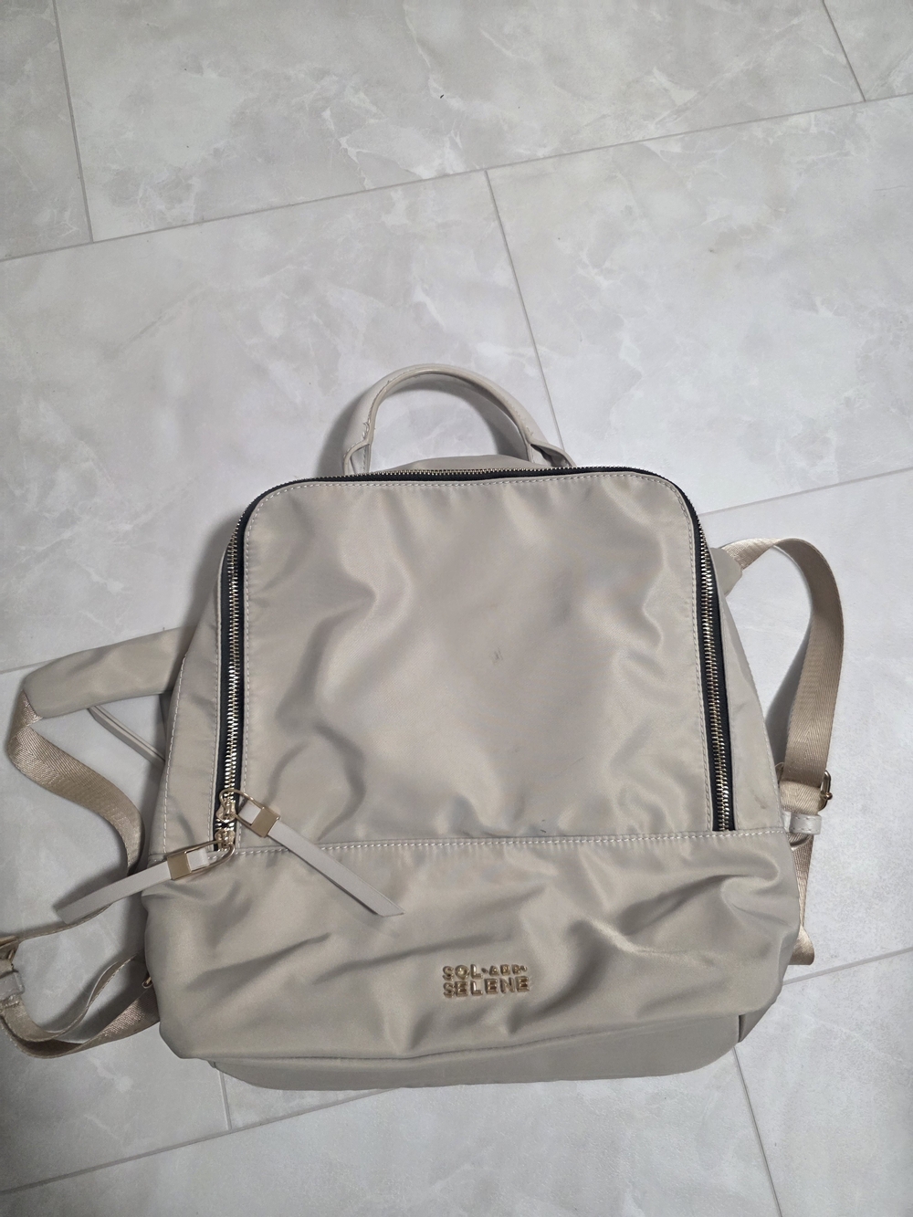 Light Beige Nylon Backpack with Gold Logo and Dual Zip Accents - Sol And Selene